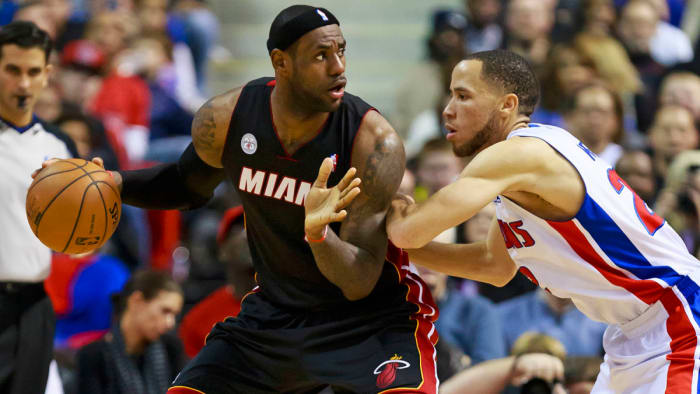 Miami Heat small forward LeBron James is defended by Detroit Pistons small forward Tayshaun Prince.
